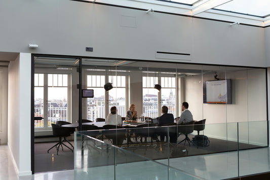 group of people in an office having a meeting.