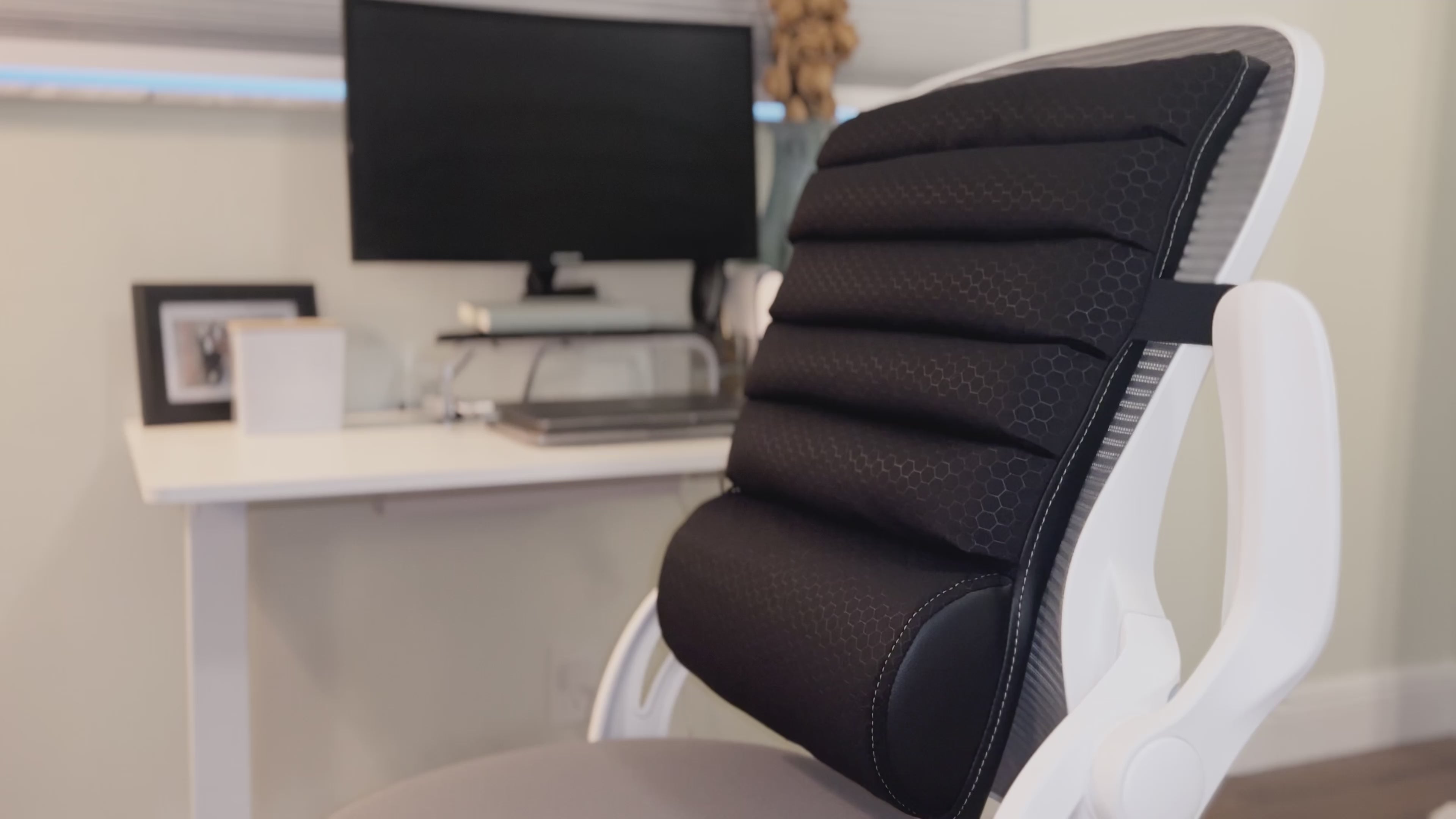 Load video: person describing use and purpose of the back cushion